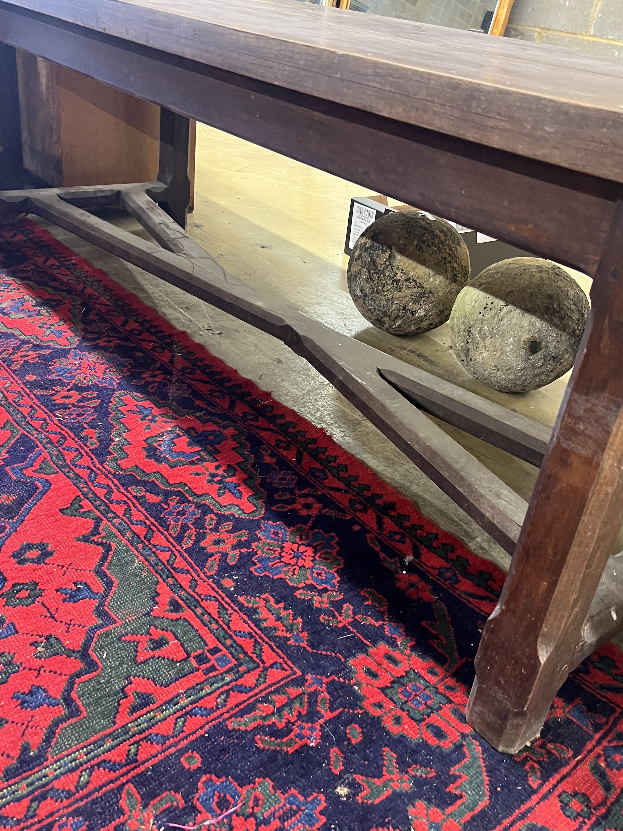 A late 19th century French oak refectory dining table with 'X' stretcher, length 210cm, width 79cm, height 73cm
